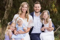 Family photo with children playing